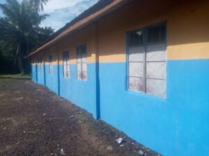 Exterior view of a blue and yellow biulding.